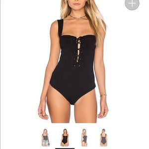 TWO free people bodysuits